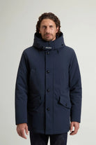 Stretch Parka Melton Blue Coat displayed on a model, featuring a stand-up collar and adjustable hood.