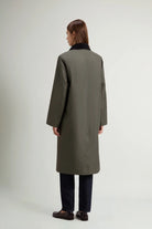 Waxed Coat Waxed Dark Green Coat showing the back view on a model in a light background.