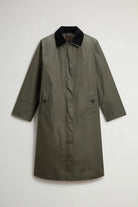 Waxed Coat Waxed Dark Green Coat showcasing oversized design with contrasting velvet collar and side pockets.
