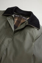 Waxed Coat Waxed Dark Green Coat featuring contrasting velvet collar and sherpa lining.