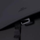 Close-up of the magnetic closure and strap on the Kumo Medium Lotus Infinity Black Backpack.